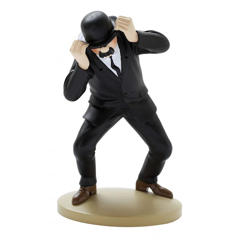 A hand-painted 12cm resin figure of Detective Thompson from Tintin, dressed in a black suit, white shirt, black tie, and brown shoes. He is standing on a circular beige base in an awkward, wide-legged crouching stance, using both hands to lift his black bowler hat slightly off his face, revealing his distinctive black walrus mustache.