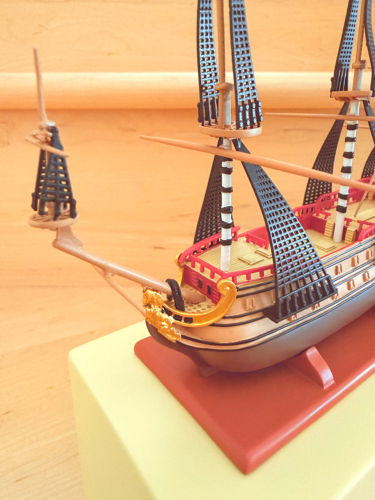 Close-up front quarter view of The Unicorn collectible model ship from The Adventures of Tintin, showcasing its bowsprit, intricate rigging, and structured sails on the Shopify admin panel.