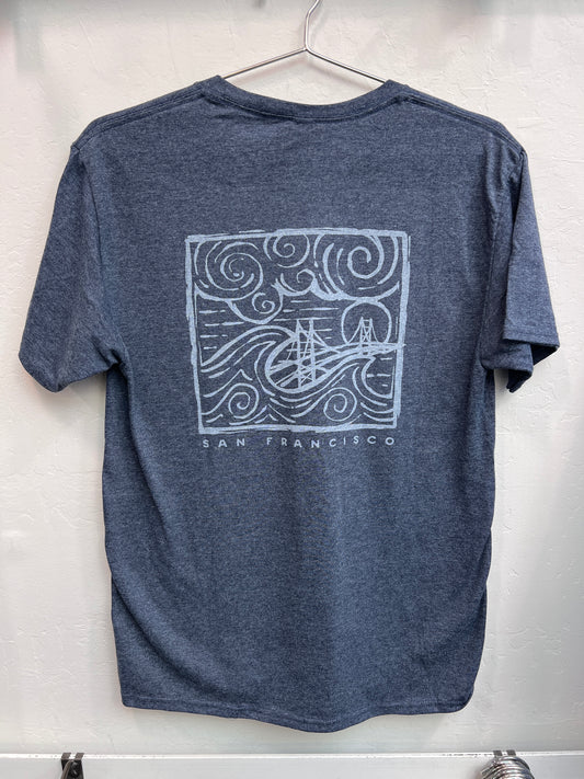 Retro Golden Gate Bridge design with swirling fog and waves printed on the back of a navy heather unisex t-shirt.