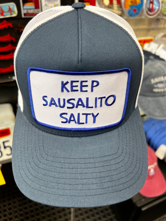 Keep Sausalito Salty Snapback Trucker Cap in gray and white with a large rectangular "Keep Sausalito Salty" embroidered patch on the front crown.