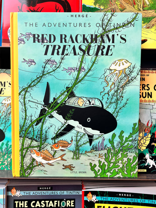 Front cover of 'The Adventures of Tintin: Red Rackham's Treasure' large format hardcover facsimile, featuring Tintin and Snowy in a shark submarine underwater.