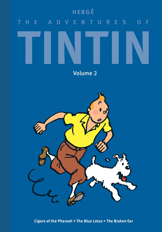 Front cover of 'The Adventures of Tintin: Volume 2' deluxe hardcover edition featuring a blue background. The illustration shows Tintin in a yellow shirt and blue trousers running with Snowy the dog. The bottom of the cover lists the included stories: Cigars of the Pharaoh, The Blue Lotus, and The Broken Ear.