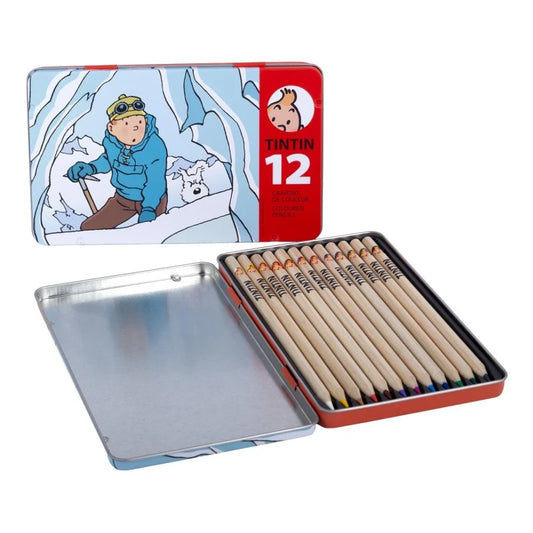 Open collectible metal tin featuring artwork from Tintin in Tibet on the lid, revealing twelve wooden colored pencils nestled inside alongside an empty silver storage compartment.
