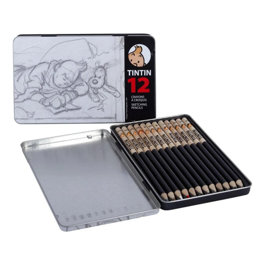 Open collectible metal tin featuring an illustration of Tintin and Snowy sketching from Tintin in Tibet on the lid, displaying twelve black sketch pencils nestled inside alongside a silver metal storage compartment.