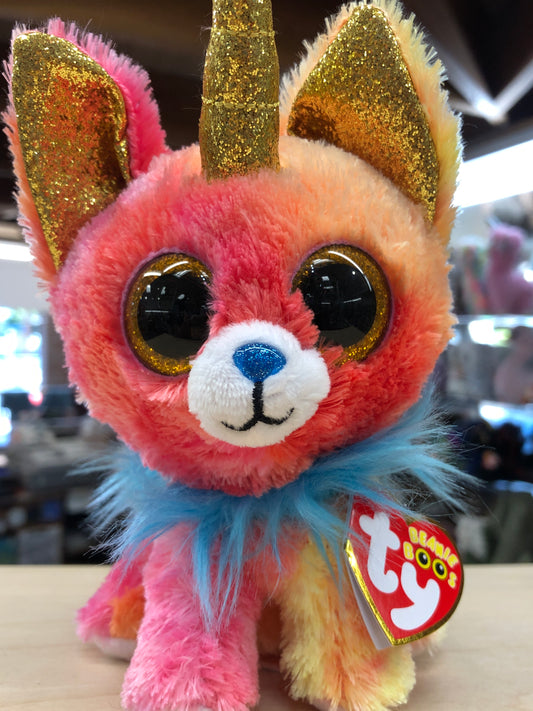 Colorful Ty Beanie Boo plush dog with sparkly unicorn horn, large eyes, and blue ruff, perfect for animal lovers and collectors