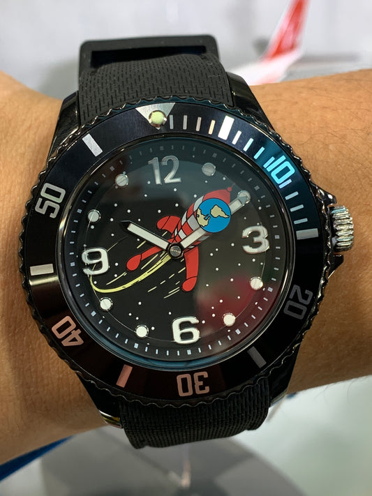 Tintin Moon Rocket watch with black band, featuring space-themed face design and luminous hands for nighttime visibility