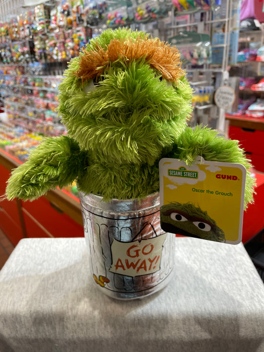 Gund Sesame Street Oscar the Grouch plush toy in trash can, with character tag, displayed in toy store