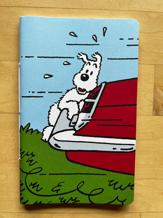 Tintin's Snowy notebook cover with cartoon dog clinging to red car bumper, 80 pages, 20x12.7cm, from The Black Island