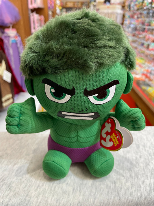 Ty Beanie Baby Hulk plush toy with angry expression, green body, purple shorts, and fuzzy hair on store shelf