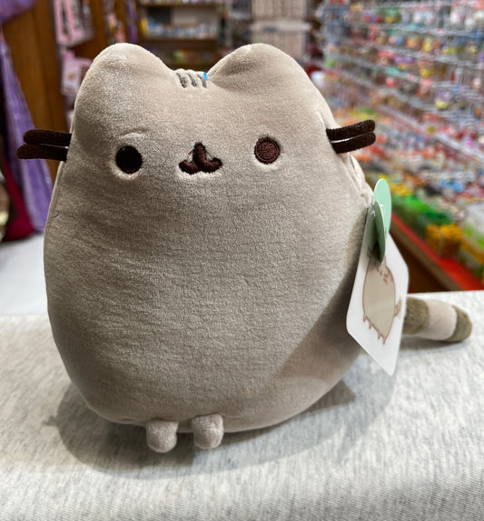 Gund Pusheen Squisheen plush toy: gray cat sitting, 6 inches, soft fabric, cute facial features, in store display