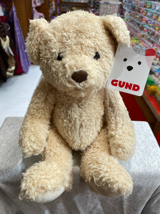 Gund Cindy Bear: soft 8-inch beige plush teddy bear with vintage-style articulated limbs, displayed in toy store