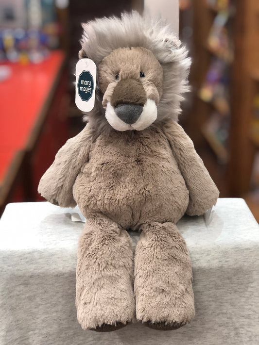Soft, cuddly Mary Meyer Marshmallow Latte Lion plush toy with fluffy mane, sitting on display, 13 inches tall