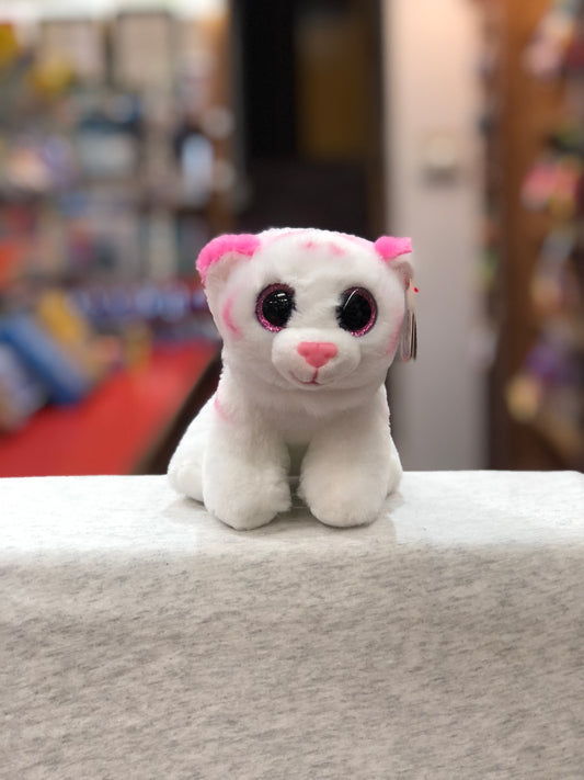 Ty Beanie Baby Tabor, white tiger plush with pink accents and sparkly eyes, sitting on display in toy store