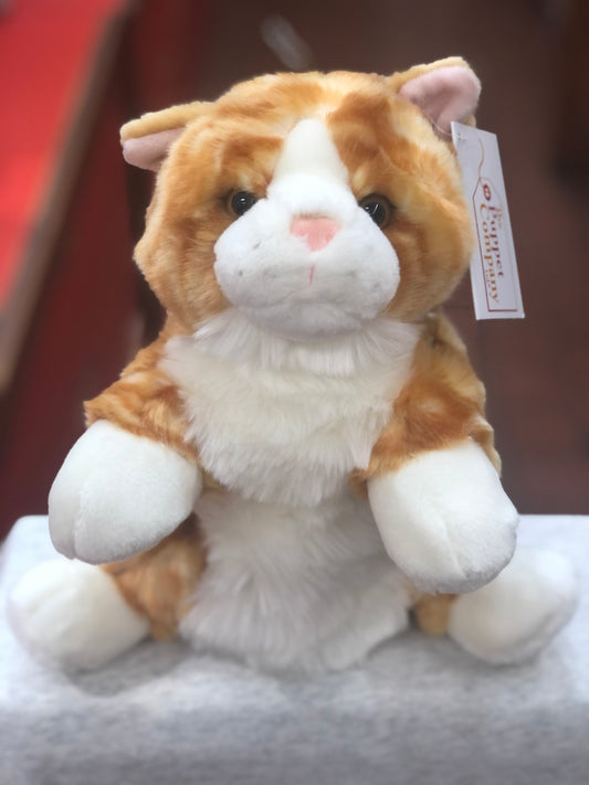 Cuddly ginger cat puppet with white paws and belly, soft plush texture, sitting upright with attached product tag