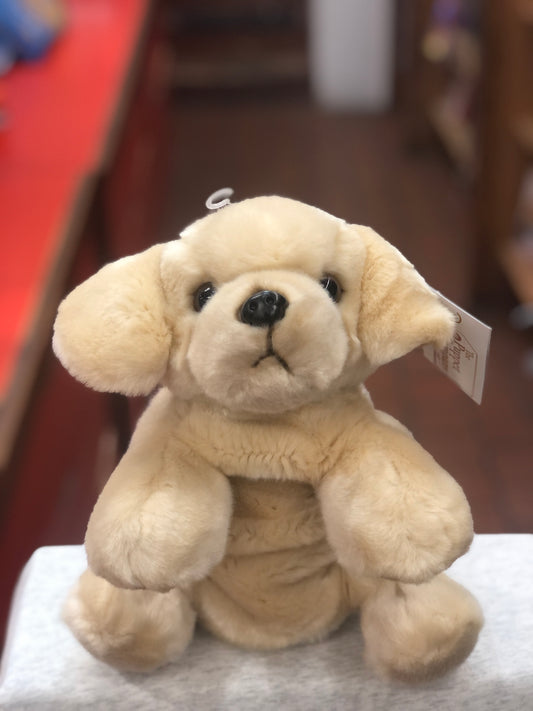 Cuddly full-bodied Labrador puppet toy with soft beige fur, sitting on display, suitable for ages 1 and up