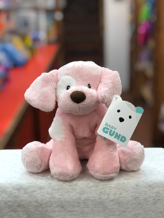 Baby Gund pink plush puppy toy with white spot, 8 inches tall, sitting on display with product tag