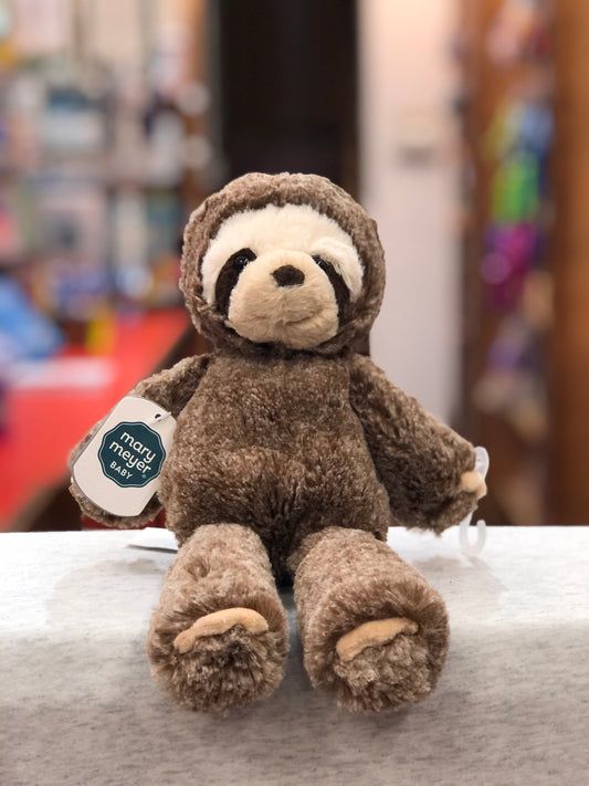 Soft, cuddly Mary Meyer Marshmallow Zoo Junior Sloth plush toy sitting on display, perfect for snuggling and comfort