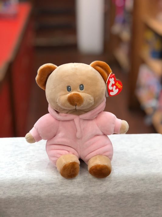 Ty Baby PJ Bear plush toy in pink hooded pajamas, sitting on white surface with Ty tag visible