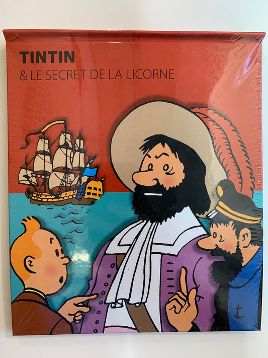 Tintin pop-up book cover: "The Secret of the Unicorn" featuring cartoon characters and ship, sealed in plastic wrap