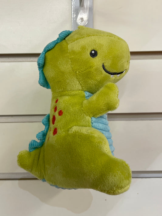 Cute green dinosaur baby rattle with blue spikes, embroidered face and red spots, perfect for little hands