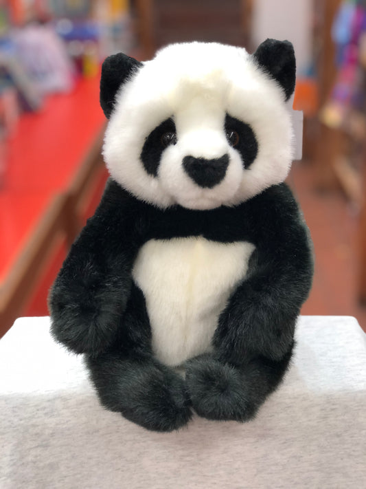 Adorable Douglas Paya panda plush toy with realistic black and white markings, seated position, and huggable form on display