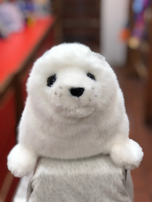 Adorable white harp seal plush toy with realistic features, soft fur, and lifelike pudgy flippers, perfect for cuddling