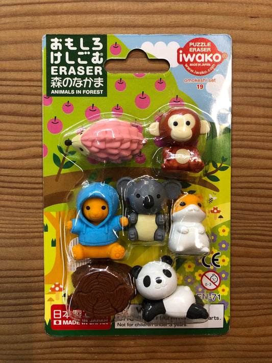 Japanese forest animals eraser set with hedgehog, monkey, bear, koala, hamster, panda, and tree stump, packaged in colorful blister pack