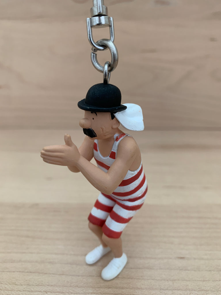 Thomson or Thompson about to take the waters key chain mini figure.  The PVC figure is 8.8cm (3.5") tall. Snap hook closure with swivel.