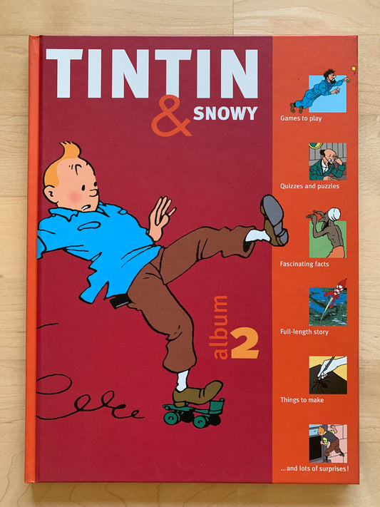 Tintin & Snowy Album 2 activity book cover featuring cartoon character, games, puzzles, and story content for young fans