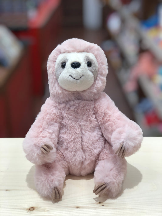 Adorable 6" soft pink sloth plush toy with white face and smiling expression, sitting on wooden surface