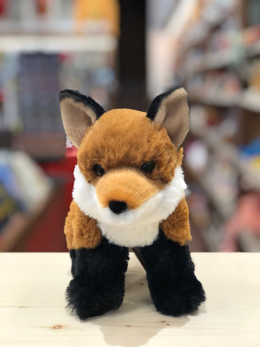 Adorable 6-inch Douglas Mini Freddie soft fox plush toy with bright orange fur, white belly, and black paws on display in store