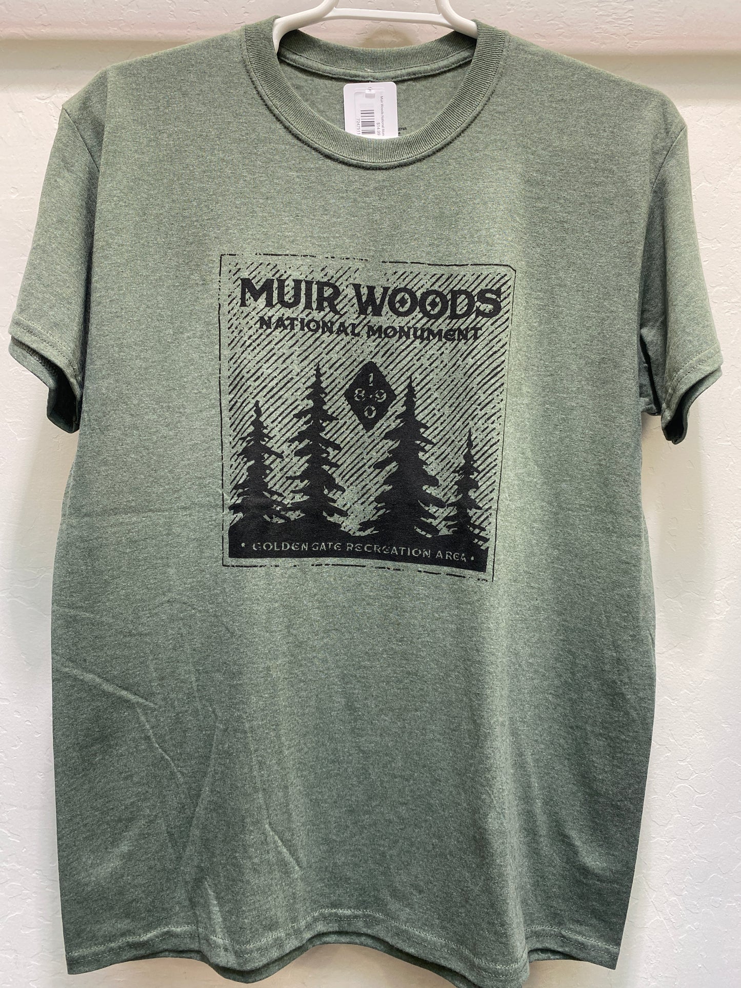 Forest green heather t-shirt featuring a black graphic print of silhouetted giant sequoia trees under the text "Muir Woods National Monument" and "Golden Gate Recreation Area".