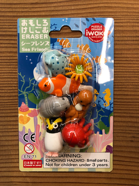 Japanese Sea Friends eraser set with 7 colorful aquatic creatures including clownfish, penguin, and octopus on underwater-themed packaging