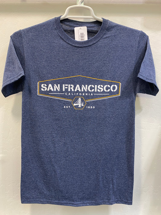 Front view of a blue heathered crewneck t-shirt hanging on a white plastic hanger against a white wall. The shirt features a sharp, screen-printed graphic across the chest with a gold hexagonal frame surrounding the bold text "SAN FRANCISCO CALIFORNIA". Below the main text, a circular emblem highlights a white silhouette of the Golden Gate Bridge, flanked by the founding year "EST. 1850".