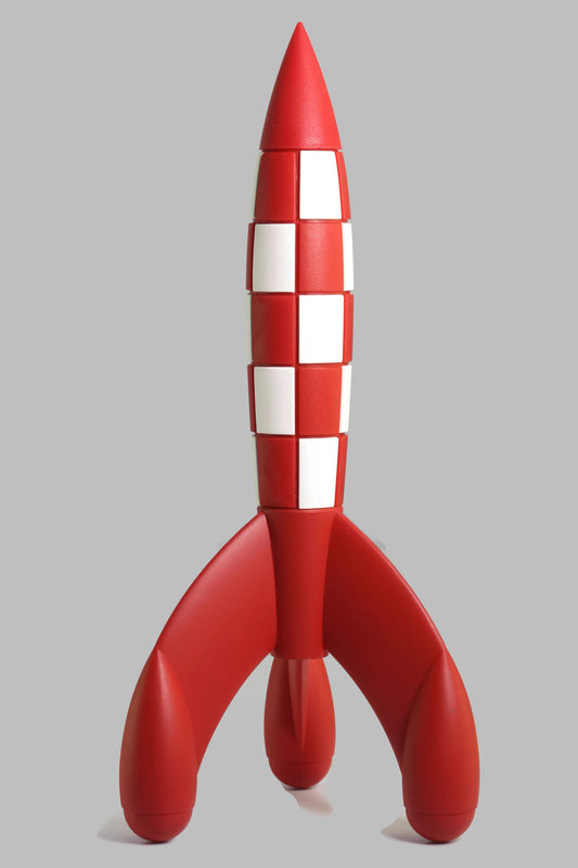 A model of the iconic red and white checkered moon rocket from The Adventures of Tintin, standing on its three curved base legs against a light gray background.
