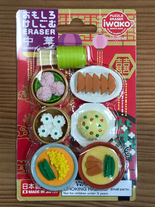 Japanese eraser set featuring 6 miniature dim sum dishes, including dumplings and rice balls, on colorful packaging