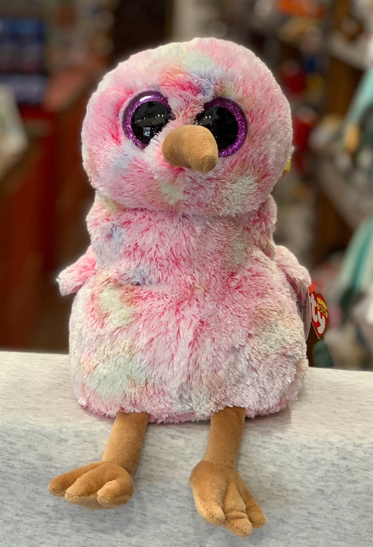 Adorable pink Ty Beanie Boo Kiwi bird plush with large sparkly purple eyes and soft fluffy fur, perfect for cuddling