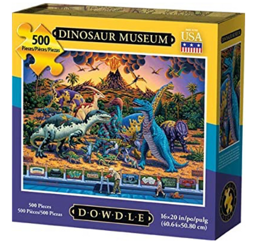 Colorful 500-piece Dowdle puzzle depicting dinosaurs in prehistoric setting with modern museum exhibits below, contrasting past and present