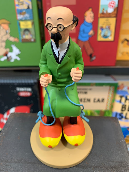 Professor Calculus resin figure with green coat and motorized skates, standing on display base amid colorful background