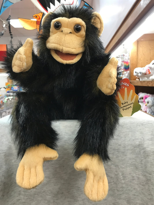 Adorable Folkmanis baby chimpanzee puppet with movable mouth and sweet expression, perfect for playtime and cuddling