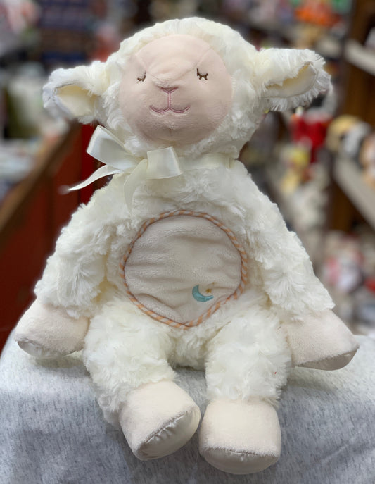 Soft white Douglas Lamb Plumpie plush toy with embroidered face, satin ribbon, and circular belly patch, perfect for infant cuddling