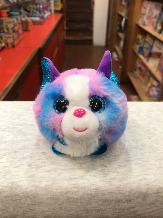 Colorful Ty Puffies Cleo husky plush toy with sparkly ears, big blue eyes, and pink nose, displayed in toy store