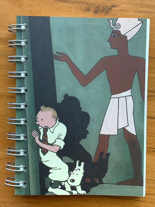 Tintin spiral notebook featuring Cigars of the Pharaoh cover art with Tintin, Snowy, and Egyptian figure on green background