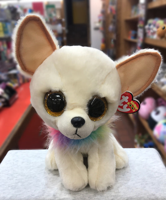 Ty Beanie Boo Chewey Chihuahua plush toy with large golden eyes, white fur, and colorful ruff, displayed in a toy store