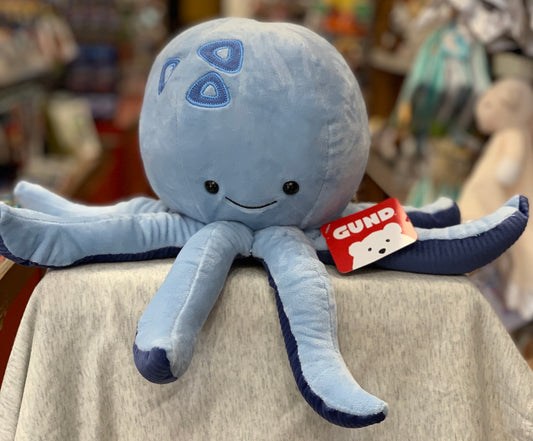 Gund Marley plush octopus toy, light blue with smiling face and navy accents, 15 inches, soft and whimsical design