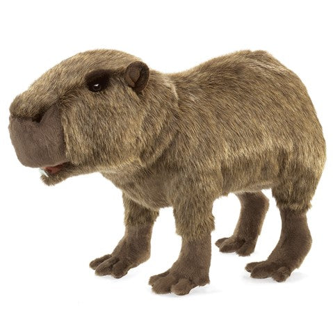 Realistic Folkmanis capybara puppet with movable mouth and legs, brown fur, and cuddly appearance for interactive play