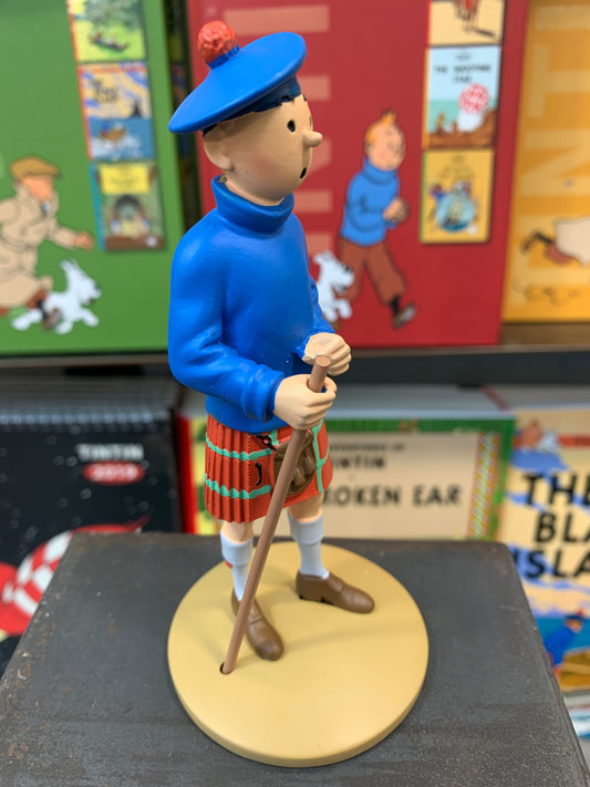 Tintin resin figure in Scottish kilt and blue sweater, holding walking stick, from The Black Island adventure, 12cm tall